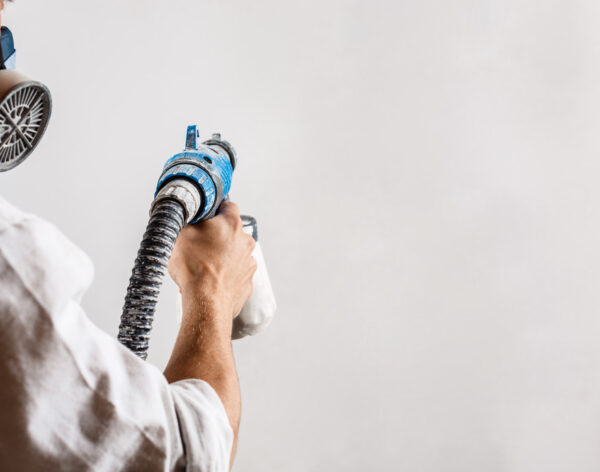 worker-painting-wall-with-spray-gun-white-color (1)