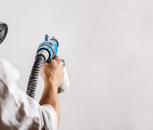 worker-painting-wall-with-spray-gun-white-color (1)
